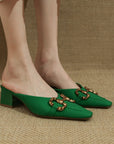 CD Buckled Green Mule Heels