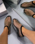 Black mesh shoes with rhinestone embellishments