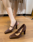 Brown high-heeled Mary Jane sandals with a gold buckle