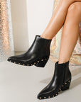 Black ankle boots with studded details