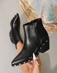 Black ankle boots with rivet studded details