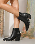 Black ankle boots with rivet studded details