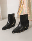 Black ankle boots with rivet studded details