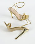 high heeled golden sandals