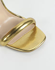 high heeled golden sandals