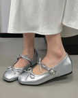 Silver ballerinas with a bow