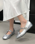 Silver ballerinas with a bow