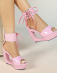 Patent hollow wedge platform heels with ribbon ankle cuff for women by VÈRV.
