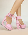 Patent hollow wedge platform heels with ribbon ankle cuff for women by VÈRV.
