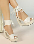 Patent hollow wedge platform heels with ribbon ankle cuff for women by VÈRV.