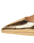 Gold high-heeled shoe with a cracked pattern