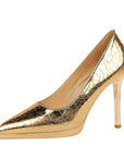 Gold high-heeled shoe with a cracked pattern