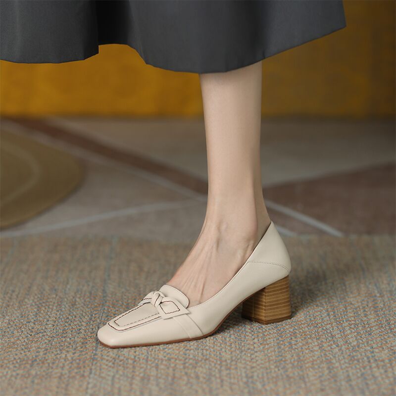 Beige loafers with brown heels 