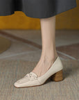 Beige loafers with brown heels 