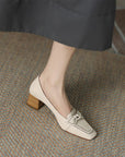 Beige loafers with brown heels 