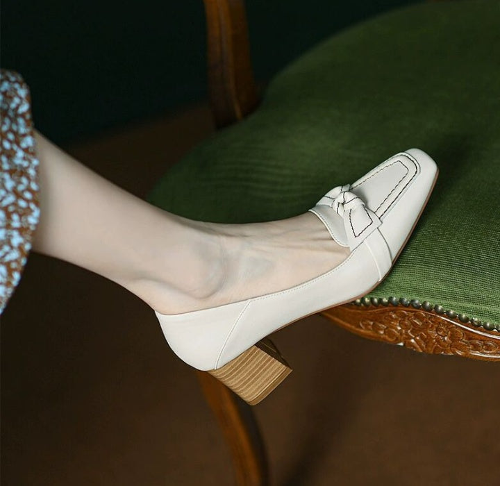 Beige loafers with brown heels 