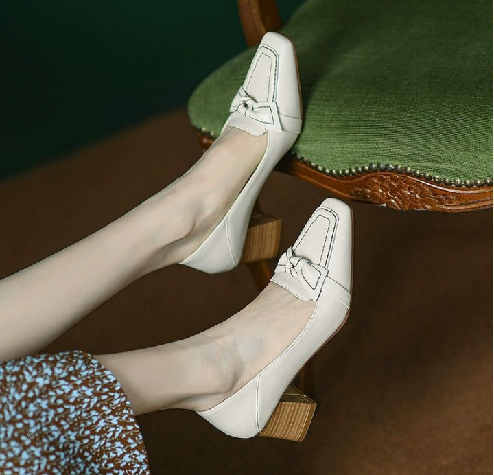 Beige loafers with brown heels 