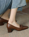 Brown loafers with brown heels 