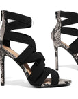 Black strappy high-heeled shoes with snake print
