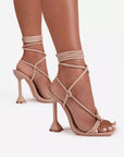 Tan strappy high-heeled sandals