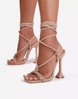 Tan strappy high-heeled sandals