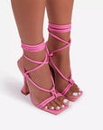Pink strappy high-heeled sandals
