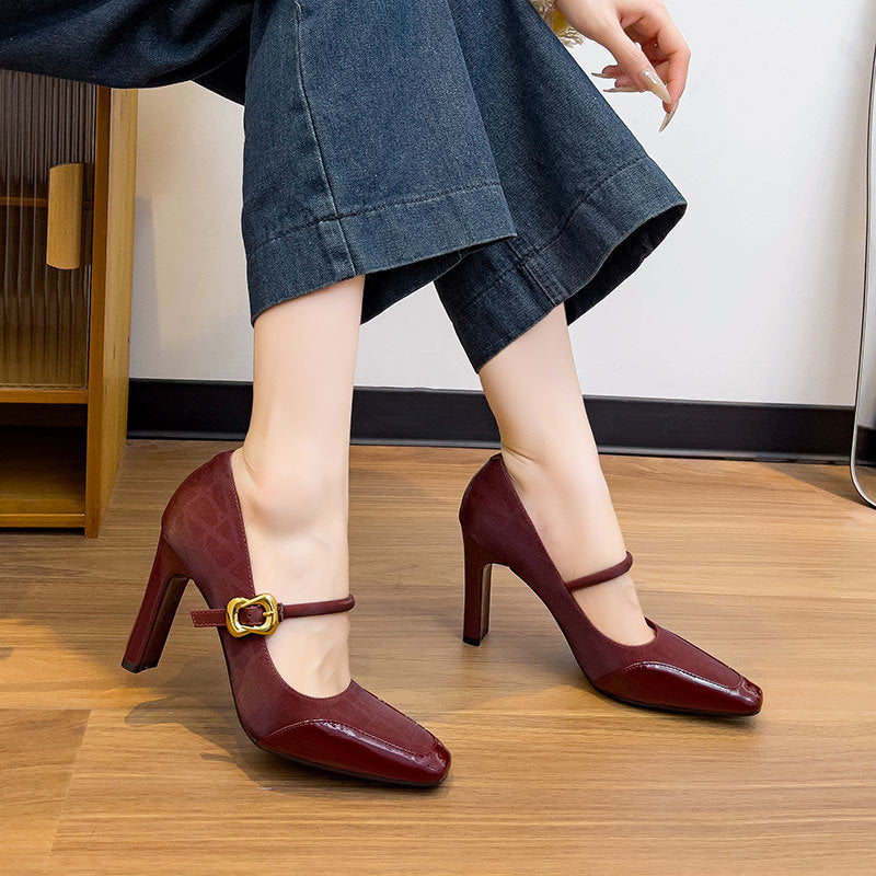 Maroon high-heeled Mary Jane sandals with a gold buckle 