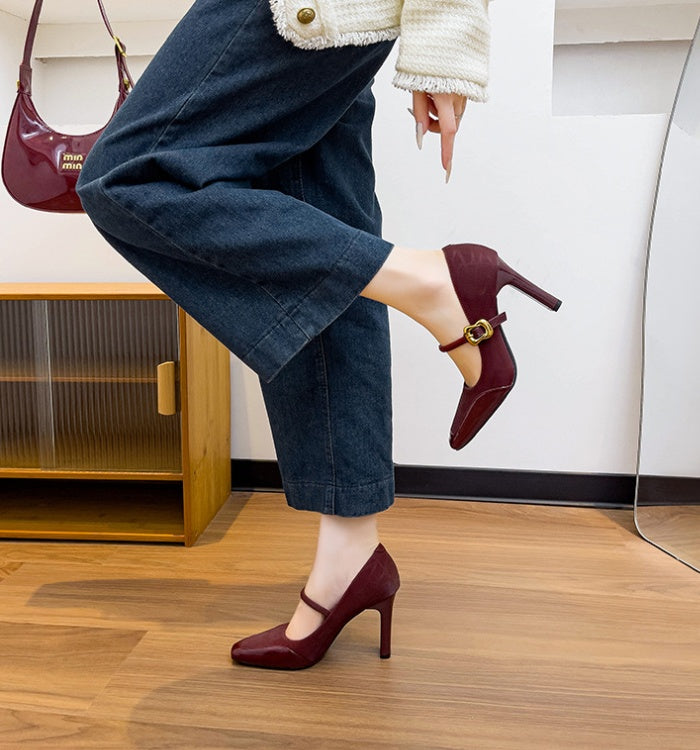 Maroon high-heeled Mary Jane sandals with a gold buckle 