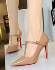 Nude patent-look T-strap pointed-toe stiletto heels with 10 cm heel and buckle strap