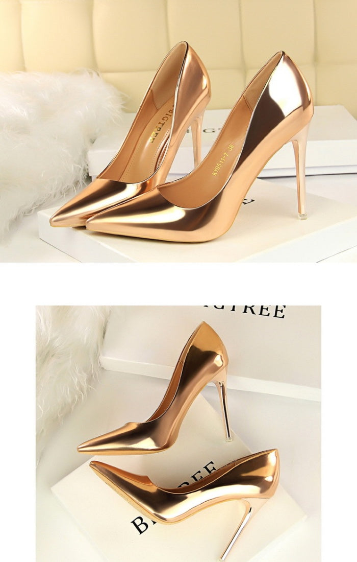 Sleek glossy pumps with a polished finish and classic pointed silhouette. Perfect for office chic, formal events, or evening elegance. Available in sizes 34–43. Step into shine and sophistication—shop now!