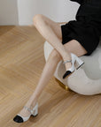 Celine black and white two-tone Mary Jane block heels with glossy cap toe and metallic strap detail by VÈRV