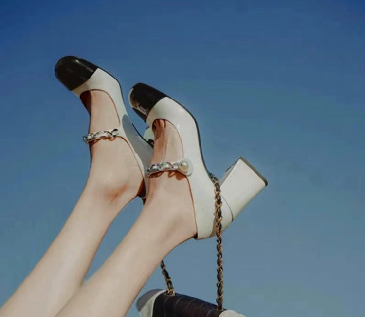 Celine black and white two-tone Mary Jane block heels with glossy cap toe and metallic strap detail by VÈRV