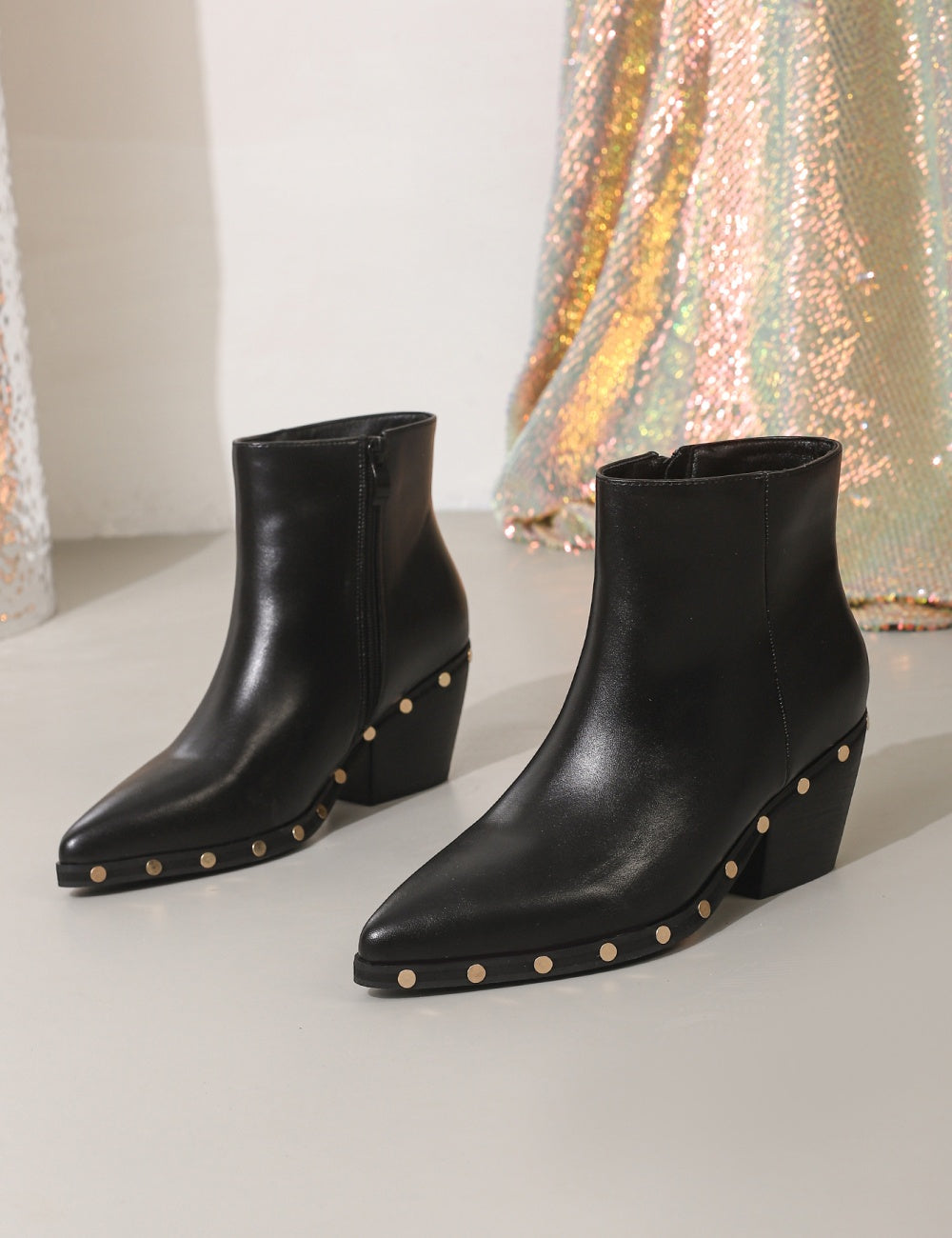 Black ankle boots with rivet studded details