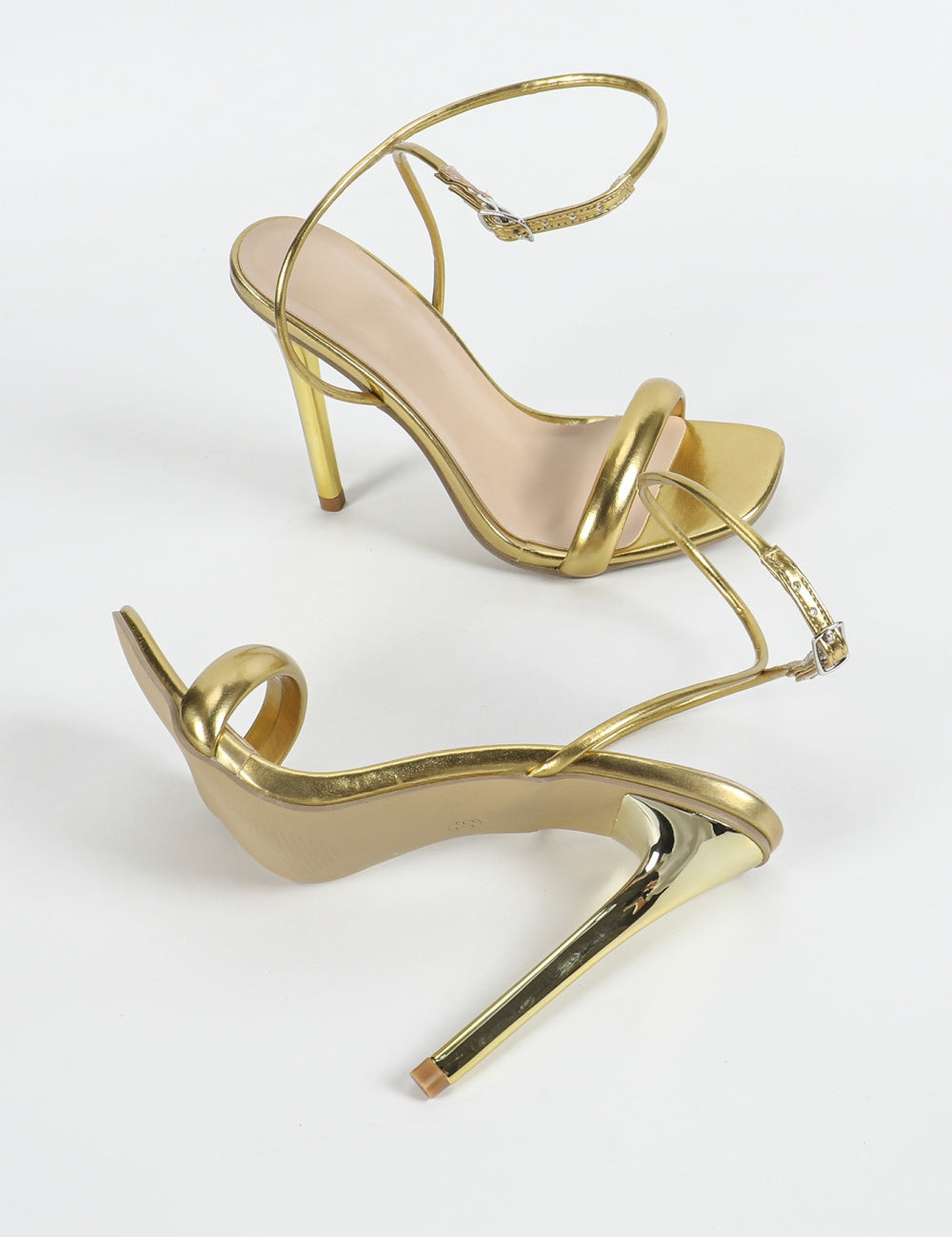 high heeled golden sandals