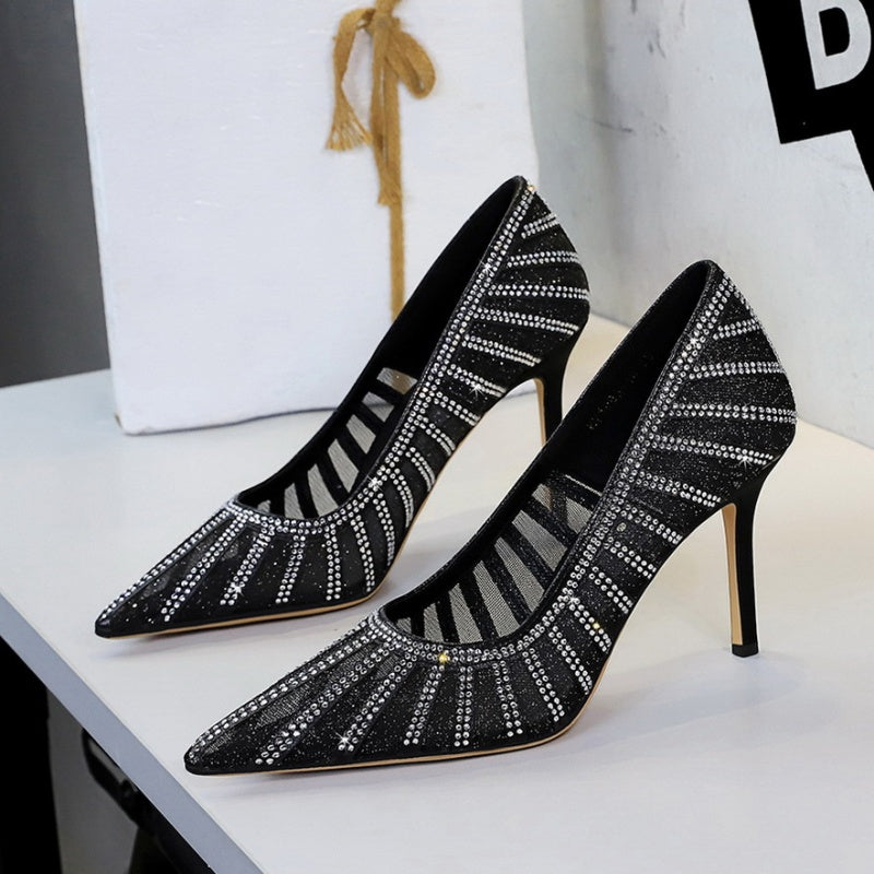 Black high-heeled shoes with rhinestone details