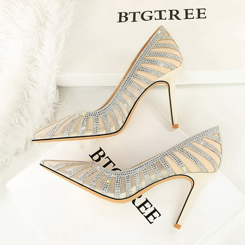 Silver high-heeled shoes with rhinestone details