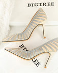 Silver high-heeled shoes with rhinestone details