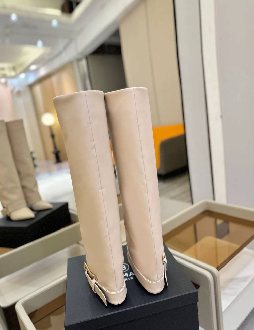 Black Givenchy Style knee-high boot with a gold buckle