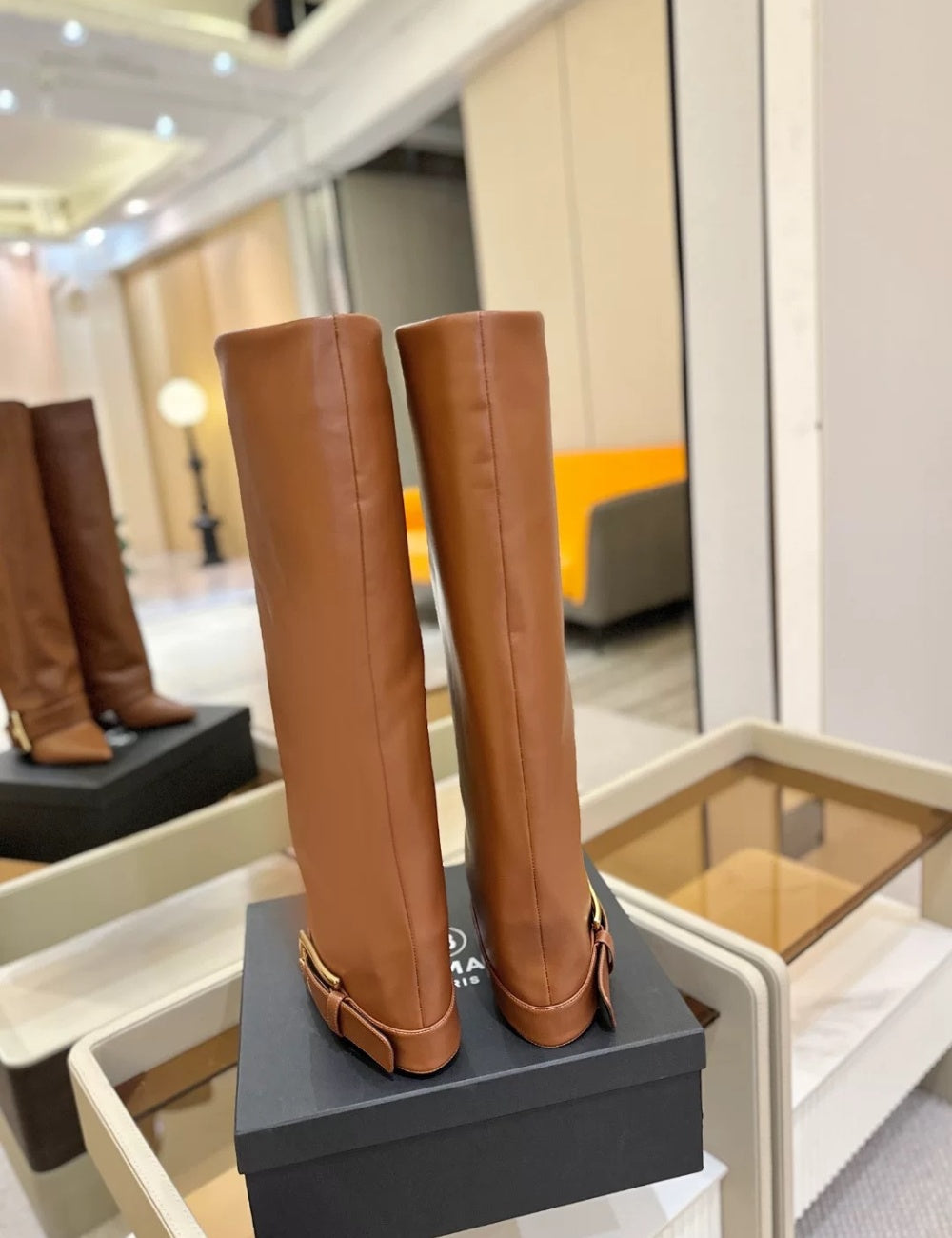 Black Givenchy Style knee-high boot with a gold buckle