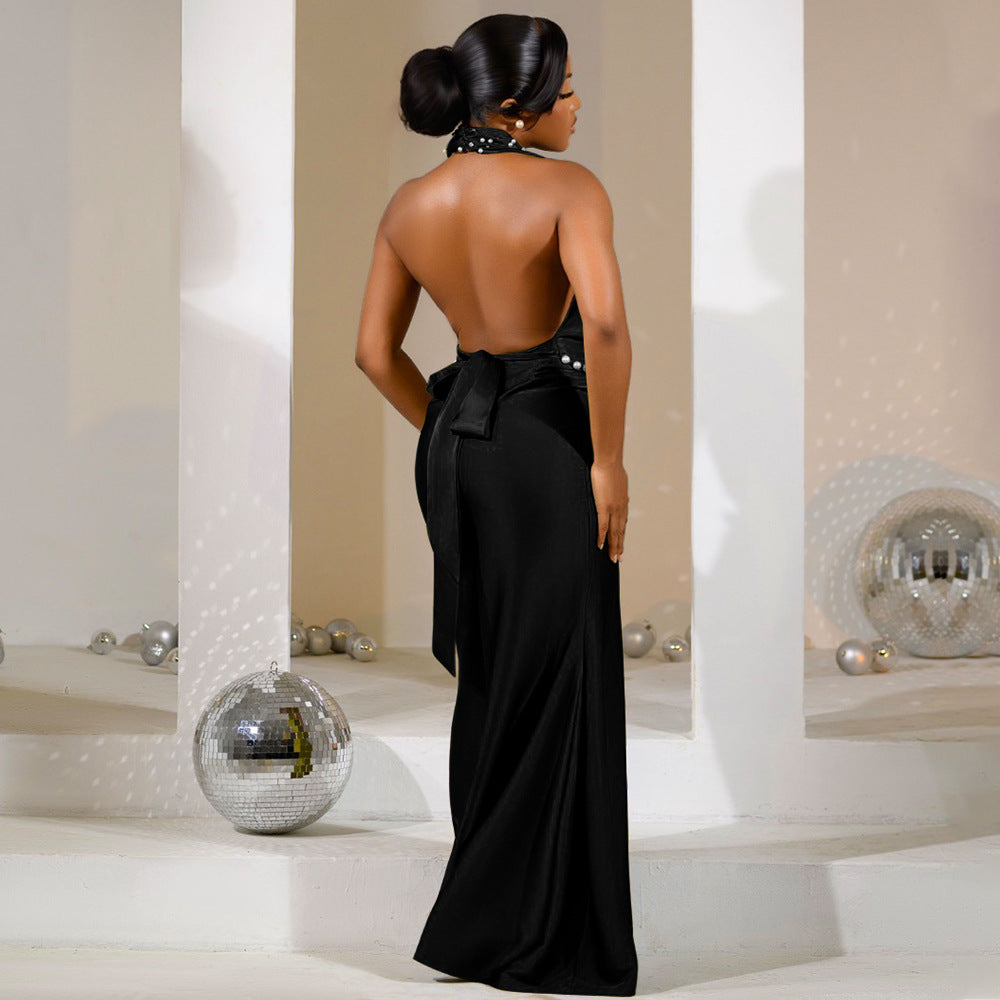 black evening backless gown with pearl accents, plunged neck