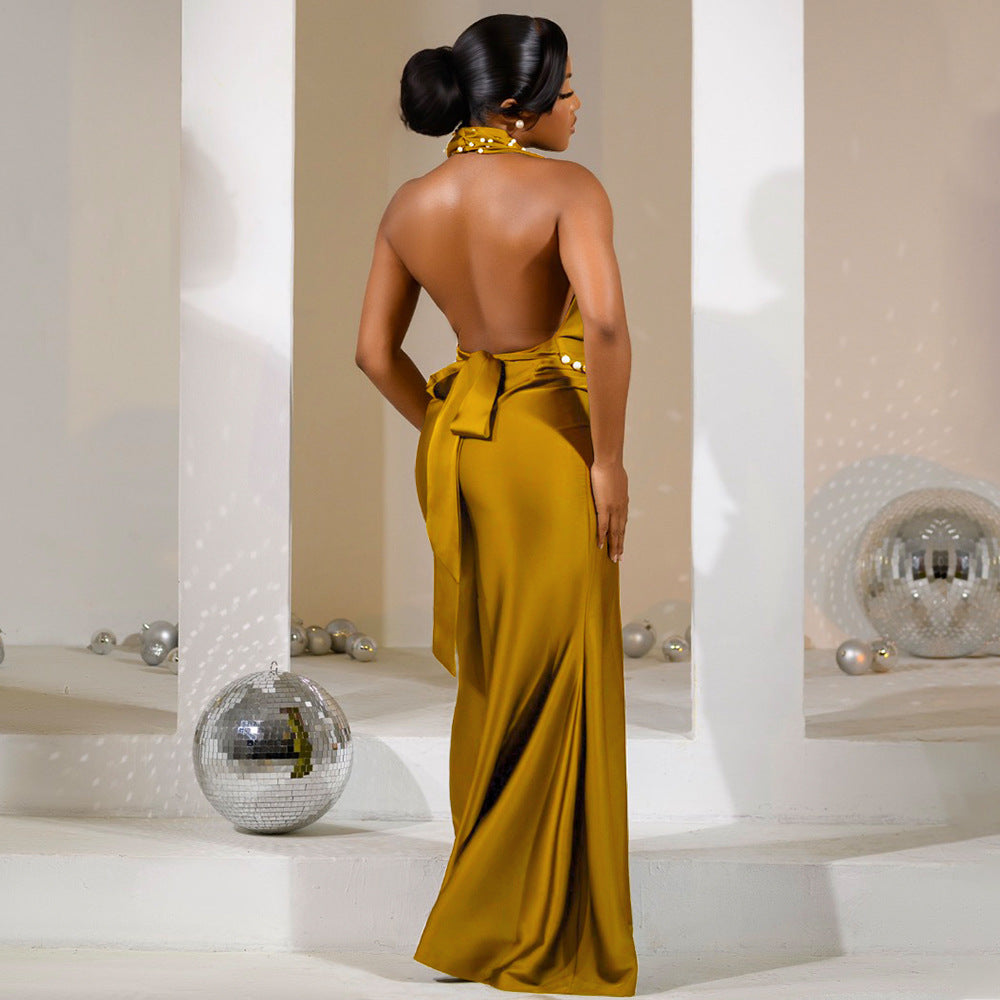 black evening backless gown with pearl accents, plunged neck
