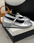 Silver ballerinas with a bow