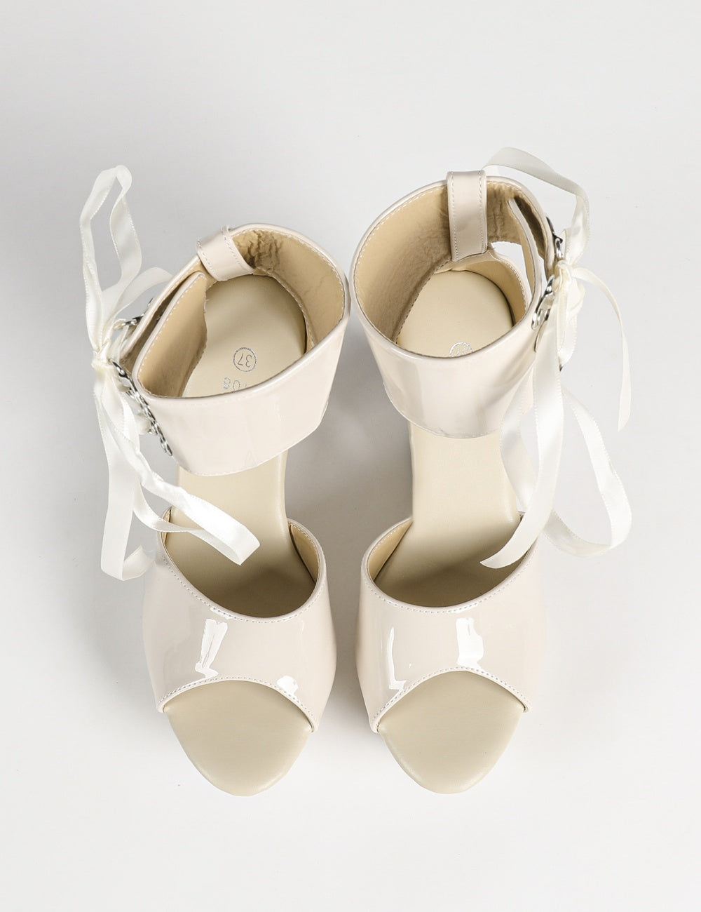 Patent hollow wedge platform heels with ribbon ankle cuff for women by VÈRV.