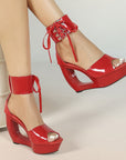 Patent hollow wedge platform heels with ribbon ankle cuff for women by VÈRV.