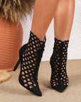 Black pointed toe mesh ankle boots with open lattice cage design and stiletto heel
